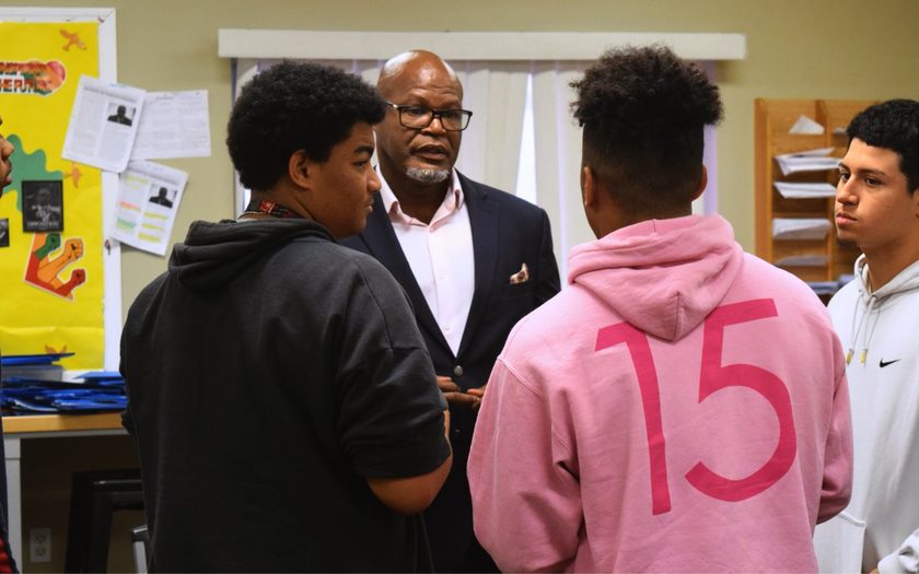 Principal George Joyce III talking with Sunfire students