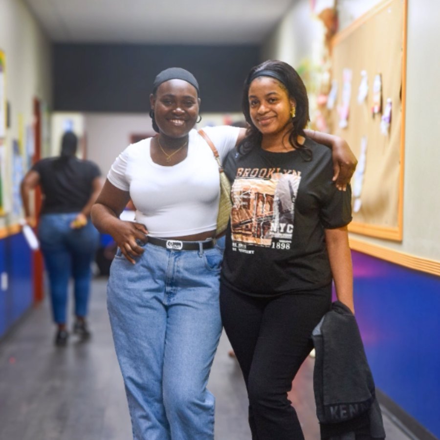 Two Sunfire students walking together in the hallway